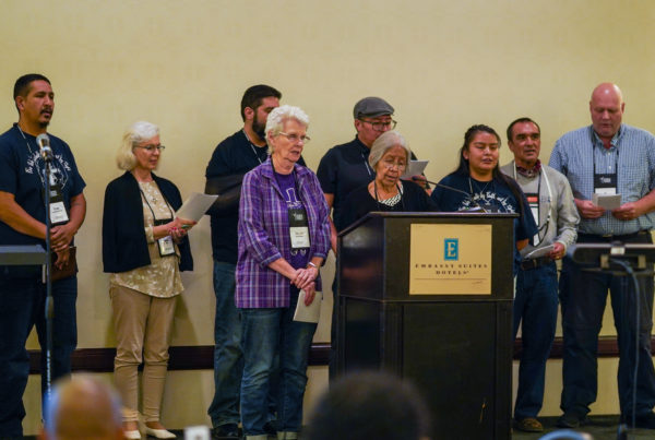 The members of the NAIM council leading a song during the racial/ethnic councils joint meeting.